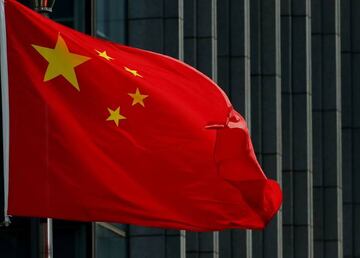 The Chinese national flag is seen on a flagpole in Beijing on August 8, 2016.  Most of the five stars on the Chinese flags being used at medal ceremonies at the Rio Olympics are misaligned, officials said, prompting a diplomatic protest and online fury.