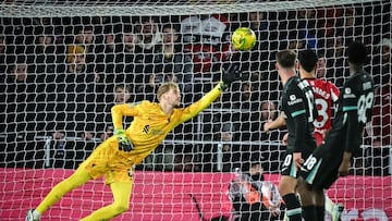 Southampton's English striker #19 Cameron Archer (unseen) shoots past Liverpool's Irish goalkeeper #62 Caoimhin Kelleher to score his team first goal during the English League Cup quarter-final football match between Southampton and Liverpool at St Mary's Stadium in Southampton, southern England, on December 18, 2024. (Photo by JUSTIN TALLIS / AFP) / RESTRICTED TO EDITORIAL USE. No use with unauthorized audio, video, data, fixture lists, club/league logos or 'live' services. Online in-match use limited to 120 images. An additional 40 images may be used in extra time. No video emulation. Social media in-match use limited to 120 images. An additional 40 images may be used in extra time. No use in betting publications, games or single club/league/player publications. /