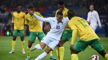 French forward Kylian Mbappe (C) fights for the ball during the friendly football match between France and South Africa at Pierre-Mauroy stadium in Villeneuve-d'Ascq, near Lille, northern France, on March 29, 2022. (Photo by FRANCK FIFE / AFP) (Photo by FRANCK FIFE/AFP via Getty Images)