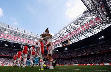 The players of Ajax and of Feyenoord Rotterdam with the mascot walk out for the Dutch Eredivisie match between Ajax Amsterdam and Feyenoord at Amsterdam ArenA on April 2, 2017 in Amsterdam, Netherlands.