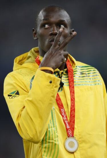 En los Juegos Olímpicos de Pekín 2008 consiguió en los 100m un registro de 9,69. También en los 200m implantó una nueva marca mundial en 19,30 y en la carrera de relevos 4×100 junto a sus compañeros jamaicanos Nesta Carter, Michael Frater y Asafa Powell marcaron el registro mundial y olímpico en 37,10. Tales hazañas le consagraron como el primer atleta en ganar tres pruebas olímpicas desde Carl Lewis en 1984. 
En la imagen en el podio con la medalla de oro de los 100m.