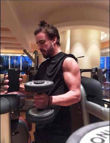 Fernando Alonso doing some light weight training.