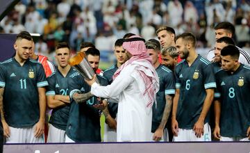 Messi picks up the trophy after the 1-0 win over Brazil in Riyadh.