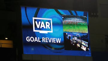 The big screen displays a message as a goal is reviewed by VAR  