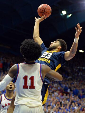 West Virginia Mountaineers forward Esa Ahmad shoots as Kansas Jayhawks guard Josh Jackson defends