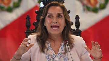 Peruvian President Dina Boluarte speaks next to the head of her ministerial team, Alberto Otarola (out of frame), during a press conference with foreign press members at the Government Palace in Lima on December 29, 2022. - Protests in Peru calling for the resignation of the current government, led by Dina Boularte after the ouster of President Pedro Castillo, could resume next week, Interior Minister Victor Rojas said on Thursday. (Photo by Cris BOURONCLE / AFP) (Photo by CRIS BOURONCLE/AFP via Getty Images)