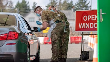 Scottish soldiers test the NHS workers for coronavirus disease (COVID-19), in a new testing facility, which has been set up at Glasgow Airport, in Glasgow, Scotland, Britain April 9, 2020.  MINISTRY OF DEFENCE/Cpl Nathan Tanuku/CROWN COPYRIGHT 2020/Handou