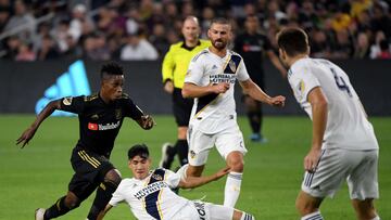 Latif Blessing #7 of Los Angeles FC dribbles the ball in front of Cristian Pavon #10, Giancarlo Gonzalez #21 and Dave Romney #4 of Los Angeles Galaxy during the second half in a 5-3 LAFC win in the Western Conference Semifinals