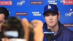 The Los Angeles Dodgers' Shohei Ohtani delivers a statement during a closed press conference as seeon on a TV in the press box at Dodger Stadium in Los Angeles on March 25, 2024. Los Angeles Dodgers superstar Shohei Ohtani denied ever betting on baseball or other sports on March 25 in his first public comments since a scandal involving his long-time interpreter erupted last week. (Photo by DAVID SWANSON / AFP)
