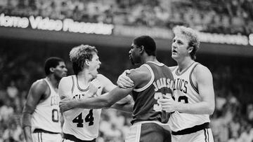 Boston Celtics' basketball player Larry Bird restraining Los Angeles Lakers' Magic Johnson from punching Celtics' Danny Ainge. Tempers flared during the third quarter of game one of the NBA Championship at the Fleet Center in Boston on May 27, 1995.
