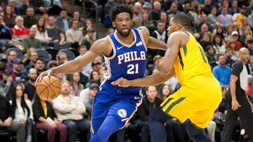 Dec 27, 2018; Salt Lake City, UT, USA; Philadelphia 76ers center Joel Embiid (21) dribbles around Utah Jazz forward Derrick Favors (15) during the first half at Vivint Smart Home Arena. Mandatory Credit: Russ Isabella-USA TODAY Sports