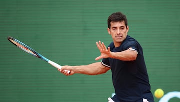 Chile's Cristian Garin plays a forehand return to Germany's Alexander Zverev during the Monte Carlo ATP Masters Series Tournament round of 32 tennis match on Court Rainier III at the Monte-Carlo Country Club in Roquebrune-Cap-Martin, south-eastern France on April 8, 2026. (Photo by Valery HACHE / AFP)