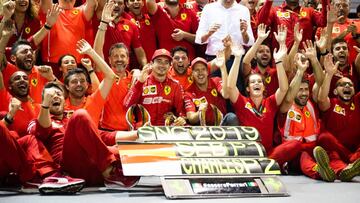 SINGAPORE, SINGAPORE - SEPTEMBER 22: Race winner Sebastian Vettel of Germany and Ferrari and second placed Charles Leclerc of Monaco and Ferrari celebrate with their team during the F1 Grand Prix of Singapore at Marina Bay Street Circuit on September 22,