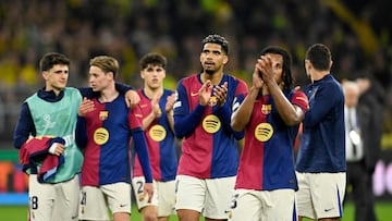 Barcelona's players celebrate after the end of the UEFA Champions League quarter-final second leg football match between BVB Borussia Dortmund and FC Barcelona in Dortmund, western Germany on April 15, 2025. Barcelona qualified for the Champions League semi-finals 5-3 on aggregate, despite losing Tuesday's second leg tie 3-1 at Borussia Dortmund. (Photo by INA FASSBENDER / AFP)