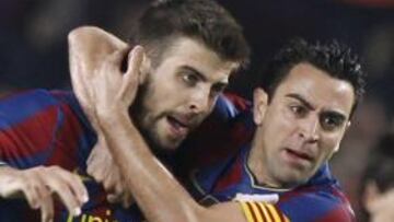 Piqué se entrena al margen y Xavi lo hace a menor ritmo