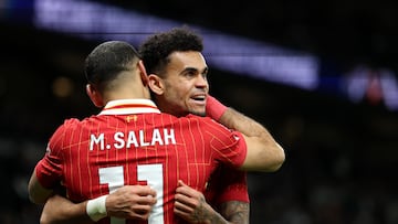 LONDON, ENGLAND - DECEMBER 22: Luis Diaz of Liverpool celebrates scoring his sides sixth goal with team mate Mohamed Salah during the Premier League match between Tottenham Hotspur FC and Liverpool FC at Tottenham Hotspur Stadium on December 22, 2024 in London, England. (Photo by Alex Pantling/Getty Images)