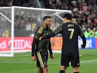 LOS ANGELES, CALIFORNIA - FEBRUARY 21: Denis Bouanga #99 of Los Angeles FC celebrates with teammate Son Heung-Min #7 after scoring the team's second goal during the MLS match between Los Angeles Football Club and Inter Miami CF at Los Angeles Memorial Coliseum on February 21, 2026 in Los Angeles, California. Kevork Djansezian/Getty Images/AFP (Photo by KEVORK DJANSEZIAN / GETTY IMAGES NORTH AMERICA / Getty Images via AFP)