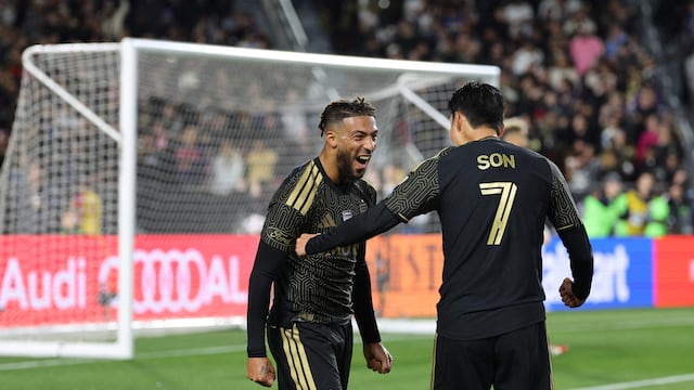 LOS ANGELES, CALIFORNIA - FEBRUARY 21: Denis Bouanga #99 of Los Angeles FC celebrates with teammate Son Heung-Min #7 after scoring the team's second goal during the MLS match between Los Angeles Football Club and Inter Miami CF at Los Angeles Memorial Coliseum on February 21, 2026 in Los Angeles, California. Kevork Djansezian/Getty Images/AFP (Photo by KEVORK DJANSEZIAN / GETTY IMAGES NORTH AMERICA / Getty Images via AFP)