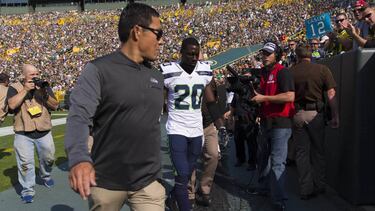 Sep 10, 2017; Green Bay, WI, USA; Seattle Seahawks cornerback Jeremy Lane (20) is escorted from the field after being ejected from the game during the first quarter against the Green Bay Packers at Lambeau Field. Mandatory Credit: Jeff Hanisch-USA TODAY Sports