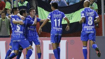 Angel Gonzalez of Argentina's Godoy Cruz celebrates with teammates after scoring against Paraguay's Libertad during a Copa Libertadores soccer game in Asuncion, Paraguay, Tuesday, April 11, 2017.(AP Photo/Jorge Saenz)