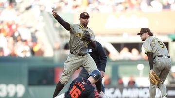 SAN FRANCISCO, CALIFORNIA - SEPTEMBER 14: Xander Bogaerts #2 of the San Diego Padres completes the double-play throwing to first base over the top of Mark Canha #16 of the San Francisco Giants ini the bottom of the first inning at Oracle Park on September 14, 2024 in San Francisco, California. Thearon W. Henderson/Getty Images/AFP (Photo by Thearon W. Henderson / GETTY IMAGES NORTH AMERICA / Getty Images via AFP)