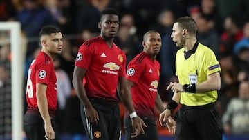 Soccer Football - Champions League - Group Stage - Group H - Valencia v Manchester United - Mestalla, Valencia, Spain - December 12, 2018 Manchester United's Andreas Pereira, Paul Pogba, Ashley Young and referee Georgi Kabakov look on Action Images
