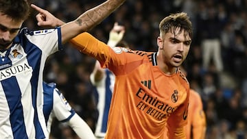 Real Sociedad's Spanish midfielder #23 Brais Mendez and Real Madrid's Spanish defender #35 Raul Asencio react during the Spanish Copa del Rey (King's Cup) semi-final first leg football match between Real Sociedad and Real Madrid CF at the Anoeta stadium in San Sebastian, on February 26, 2025. (Photo by ANDER GILLENEA / AFP)