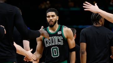 May 1, 2024; Boston, Massachusetts, USA; Boston Celtics forward Jayson Tatum (0) is congratulated by teammates during a timeout during the third quarter of game five of the first round of the 2024 NBA playoffs against the Miami Heat at TD Garden. Mandatory Credit: Winslow Townson-USA TODAY Sports