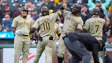 SAN FRANCISCO, CALIFORNIA - APRIL 06: Jurickson Profar #10 of the San Diego Padres celebrates with teammates after he hit a grand slam home run against the San Francisco Giants in the top of the first inning at Oracle Park on April 06, 2024 in San Francisco, California.   Thearon W. Henderson/Getty Images/AFP (Photo by Thearon W. Henderson / GETTY IMAGES NORTH AMERICA / Getty Images via AFP)