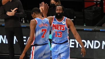 NEW YORK, NEW YORK - JANUARY 16: James Harden #13 high-fives Kevin Durant #7 of the Brooklyn Nets during the first half against the Orlando Magic at Barclays Center on January 16, 2021 in the Brooklyn borough of New York City. NOTE TO USER: User expressly acknowledges and agrees that, by downloading and or using this Photograph, user is consenting to the terms and conditions of the Getty Images License Agreement.   Sarah Stier/Getty Images/AFP
 == FOR NEWSPAPERS, INTERNET, TELCOS &amp; TELEVISION USE ONLY ==