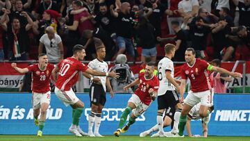 Hungary's defender Zsolt Nagy (C) celebrates scoring the opening goal with his teammates during the UEFA Nations League football match Hungary v Germany at the Puskas Arena in Budapest on June 11, 2022. (Photo by Attila KISBENEDEK / AFP)