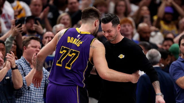 DALLAS, TEXAS - APRIL 09: (L-R) Luka Doncic #77 hugs head coach JJ Redick of the Los Angeles Lakers against the Dallas Mavericks during the fourth quarter at American Airlines Center on April 09, 2025 in Dallas, Texas. NOTE TO USER: User expressly acknowledges and agrees that, by downloading and or using this photograph, user is consenting to the terms and conditions of the Getty Images License Agreement. Sam Hodde/Getty Images/AFP (Photo by Sam Hodde / GETTY IMAGES NORTH AMERICA / Getty Images via AFP)