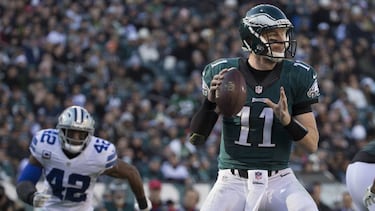 PHILADELPHIA, PA - JANUARY 1: Carson Wentz #11 of the Philadelphia Eagles looks to pass the ball against Barry Church #42 of the Dallas Cowboys in the second quarter at Lincoln Financial Field on January 1, 2017 in Philadelphia, Pennsylvania. The Eagles defeated the Cowboys 27-13. Mitchell Leff/Getty Images/AFP
== FOR NEWSPAPERS, INTERNET, TELCOS & TELEVISION USE ONLY ==