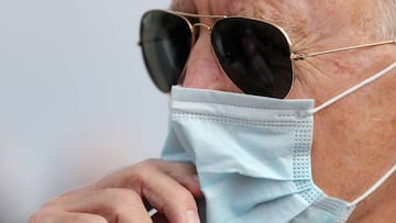 Wearing a face mask to reduce the risk posed by the coronavirus, Democratic presidential nominee Joe Biden speaks briefly with reporters before boarding a flight to Florida at New Castle County Airport October 13, 2020 in New Castle, Delaware.