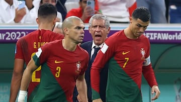 Soccer Football - FIFA World Cup Qatar 2022 - Round of 16 - Portugal v Switzerland - Lusail Stadium, Lusail, Qatar - December 6, 2022 Portugal's Cristiano Ronaldo with Pepe and coach Fernando Santos as he comes on as a substitute REUTERS/Hannah Mckay