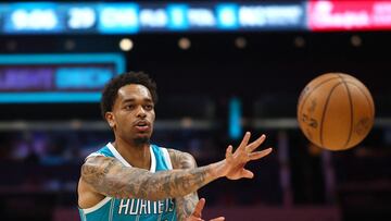 P.J. Washington #25 of the Charlotte Hornets attempts a pass during the first half of the game against the New York Knicks at Spectrum Center on January 29, 2024 in Charlotte, North Carolina.