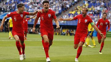 England's Harry Maguire, center, celebrates with his teammates after scoring his side opening goal during the quarterfinal match between Sweden and England at the 2018 soccer World Cup in the Samara Arena, in Samara, Russia, Saturday, July 7, 2018. (AP Photo/Francisco Seco)