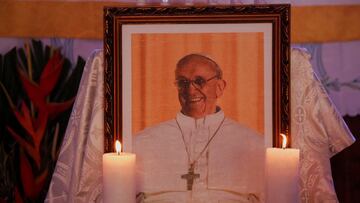 A photo of Pope Francis is seen during a Mass officiated by Geoffroy Kouadio Kouakou, priest and rector of the Basilica of Our Lady of Peace, following the death of Pope Francis, in Yamoussoukro, Ivory Coast, April 22, 2025. REUTERS/Luc Gnago
