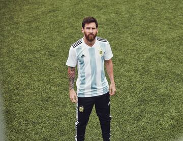 Lionel Messi models Argentina's new home shirt.