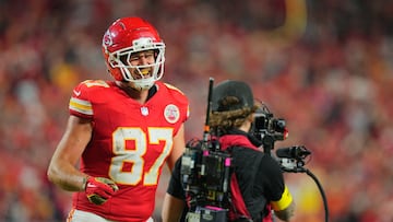 The Chiefs tight end scored against the Washington Commanders and immediately performed an ode to fiancé Taylor Swift, who watched in the stands.