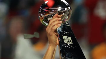 TAMPA, FLORIDA - FEBRUARY 07: Tom Brady #12 of the Tampa Bay Buccaneers hoists the Vince Lombardi Trophy after winning Super Bowl LV at Raymond James Stadium on February 07, 2021 in Tampa, Florida. The Buccaneers defeated the Chiefs 31-9.   Mike Ehrmann/G