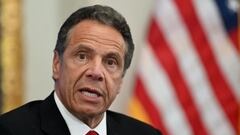 (FILES) In this file photo taken on May 26, 2020, New York Governor Andrew Cuomo speaks during a press conference at the New York Stock Exchange on Wall Street in New York City. - The number of Democrats calling on Cuomo to resign over sexual harassment a