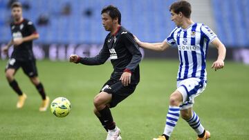 SAN SEBASTIAN, SPAIN - DECEMBER 13: Takashi Inui of Eibar is put under pressure by Aihen Munoz of Real Sociedad during the La Liga Santander match between Real Sociedad and SD Eibar at Estadio Anoeta on December 13, 2020 in San Sebastian, Spain. Sportin