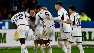 Real Madrid's players celebrate at the end of the Spanish league football match between Deportivo Alaves and Real Madrid CF at the Mendizorroza stadium in Vitoria on December 21, 2023. (Photo by ANDER GILLENEA / AFP)