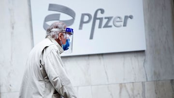 (FILES) In this file photo taken on March 11, 2021, a man wearing facemask and shield walks past the Pfizer headquarters in New York one year after the pandemic was officially declared. - The Pfizer and Moderna Covid vaccines should remain highly effective against two coronavirus variants first identified in India, according to new research carried out by US scientists. The lab-based study was carried out by the NYU Grossman School of Medicine and NYU Langone Center and is considered preliminary because it has not yet been published in a peer-reviewed journal.
"What we found is that the vaccine's antibodies are a little bit weaker against the variants, but not enough that we think it would have much of an effect on the protective ability of the vaccines," senior author Nathaniel "Ned" Landau told AFP on on May17, 2021. (Photo by Kena Betancur / AFP)