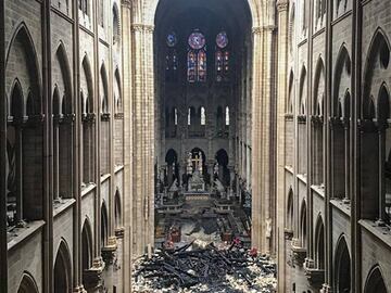 A picture taken on April 16, 2019 shows an interior view of the Notre-Dame Cathedral in Paris in the aftermath of a fire that devastated the cathedral. - The Paris fire service announced that the last remnants of the blaze were extinguished on April 16, 15 hours after the fire broke out. Thousands of Parisians and tourists watched in horror from nearby streets on April 15 as flames engulfed the building and rescuers tried to save as much as they could of the cathedral&#039;s treasures built up over centuries. (Photo by - / AFP)