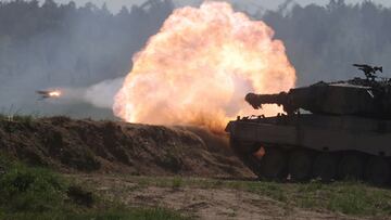FILE PHOTO: A Polish Leopard 2PL tank fires during Defender Europe 2022 military exercise of NATO troops including French, American, and Polish troops, amid the Russian invasion of Ukraine, at the military range in Bemowo Piskie, near Orzysz, Poland May 24, 2022. REUTERS/Kacper Pempel/File Photo