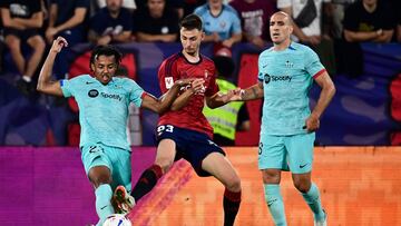 Barcelona's French defender #23 Jules Kounde (L) is challenged bz Osasuna's Spanish forward #23 Raul Garcia de Haro during the Spanish Liga football match between CA Osasuna and FC Barcelona at El Sadar stadium in Pamplona on September 3, 2023. (Photo by ANDER GILLENEA / AFP)