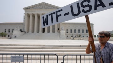 A demonstrator protests outside the U.S. Supreme Court as the court made their final rulings of their session on the issues of student loan forgiveness and LGBTQ rights in Washington, U.S. June 30, 2023. REUTERS/Jim Bourg