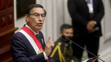 This handout picture released by the Peruvian Presidency shows President Martin Vizcarra delivering the yearly Address to the Nation from the Congress building in Lima, as part of the National Day proceedings in Lima on July 28, 2020. - With 33 million inhabitants, Peru registered more than 384,000 coronavirus cases and 18,229 deaths until Sunday&#039;s last account. It is the third country with the most infections and deaths in Latin America after Brazil and Mexico. (Photo by Andres VALLE / Peruvian Presidency / AFP) / RESTRICTED TO EDITORIAL USE - MANDATORY CREDIT &quot;AFP PHOTO / PERUVIAN PRESIDENCY / Andres VALLE&quot; - NO MARKETING NO ADVERTISING CAMPAIGNS - DISTRIBUTED AS A SERVICE TO CLIENTS